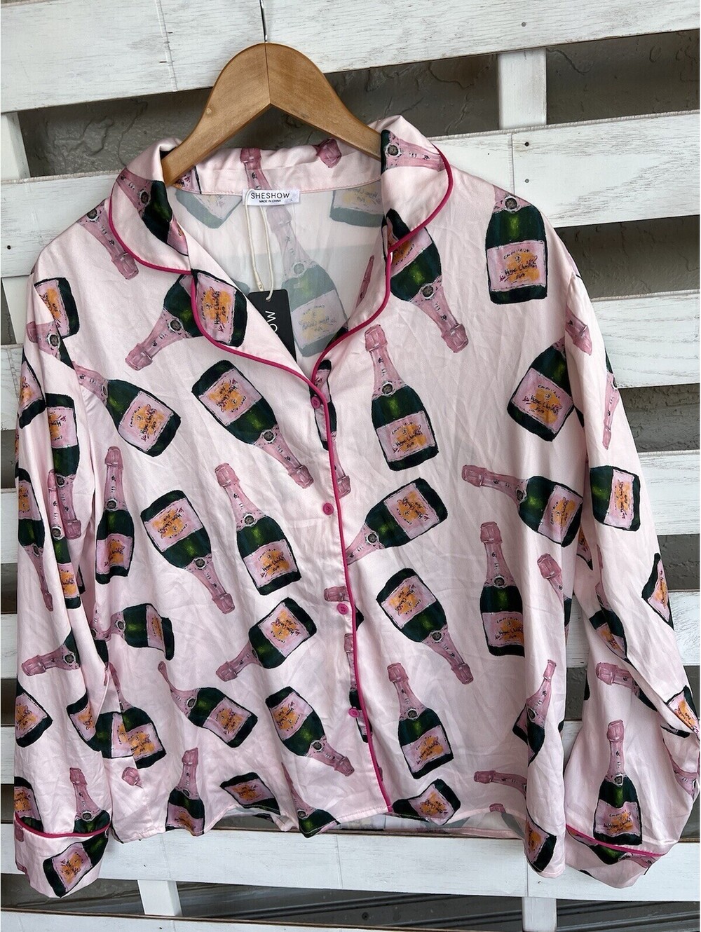 Sheshow L polyester and spandex long sleeve button up drinking bottles pajama.